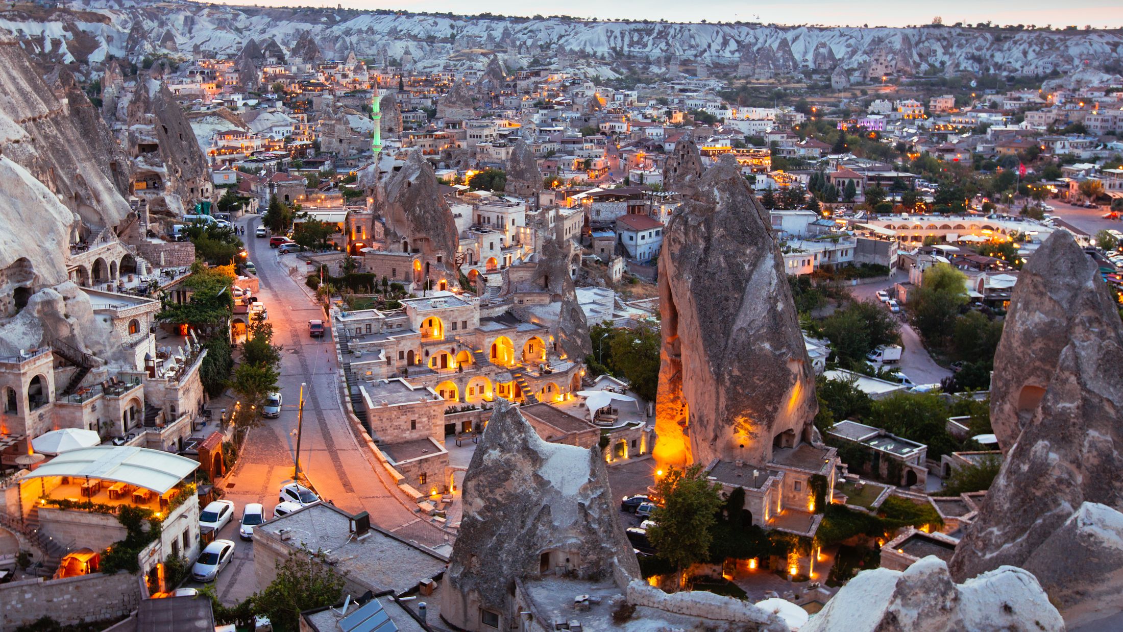 Panoramic view across Göreme and Cappadocia’s rock formations at dusk