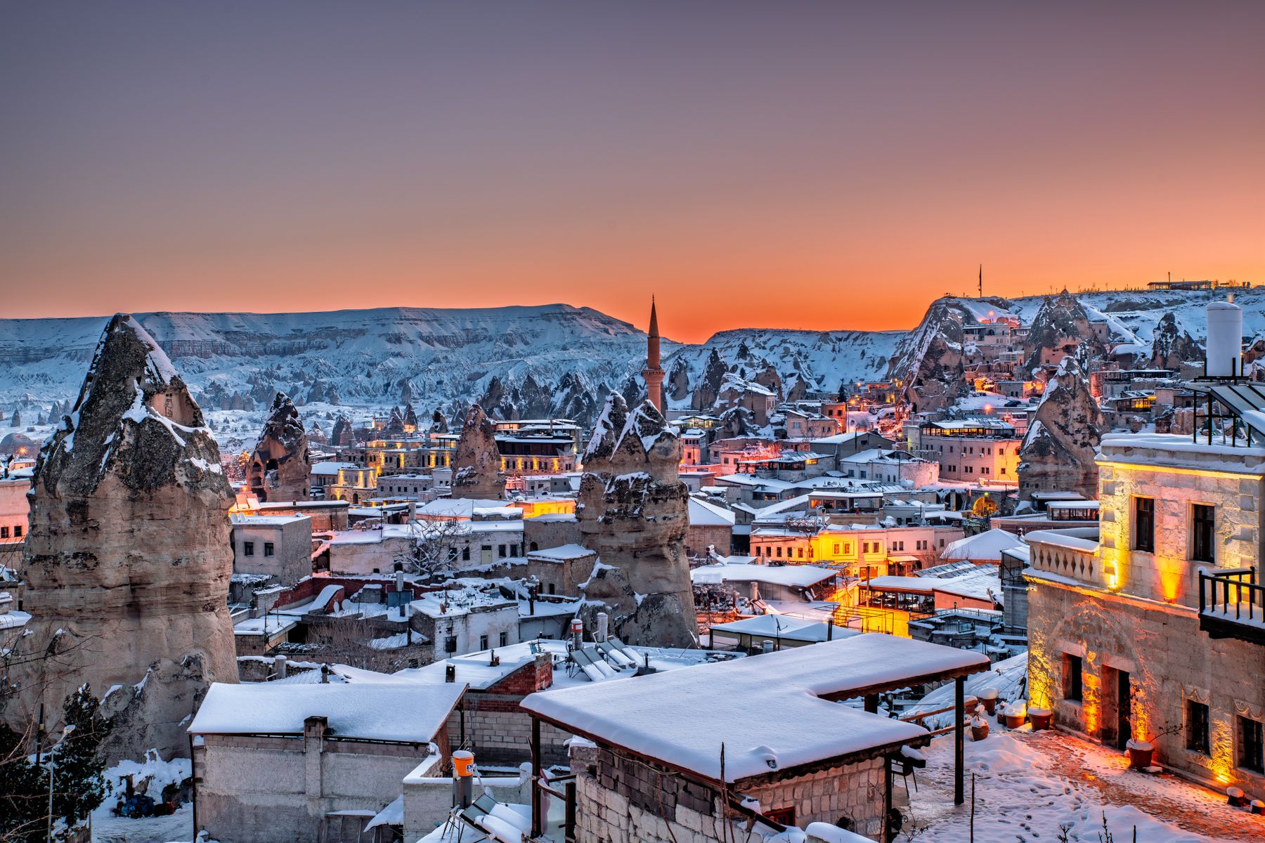 Snow-covered Göreme at winter dusk